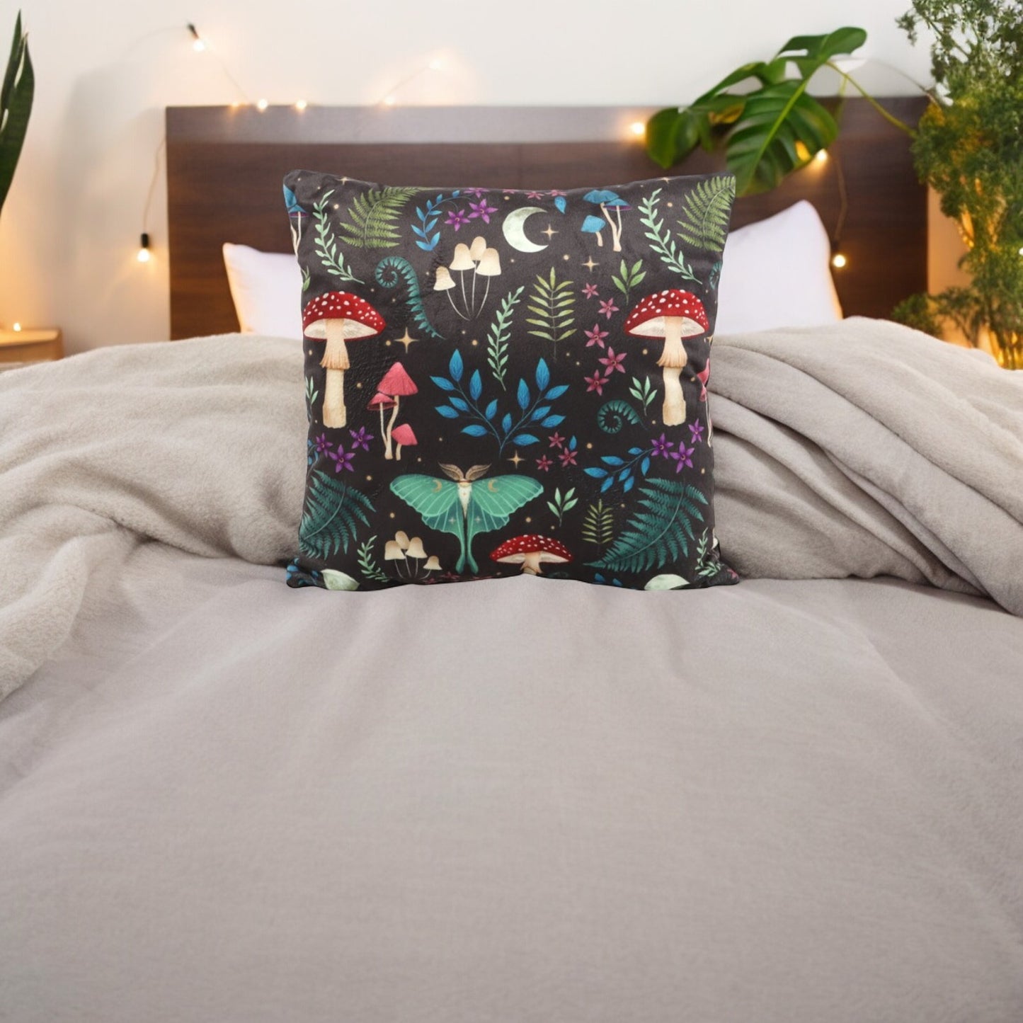 Dark Forest square cushion with mushrooms, wildflowers, moths and moons print.