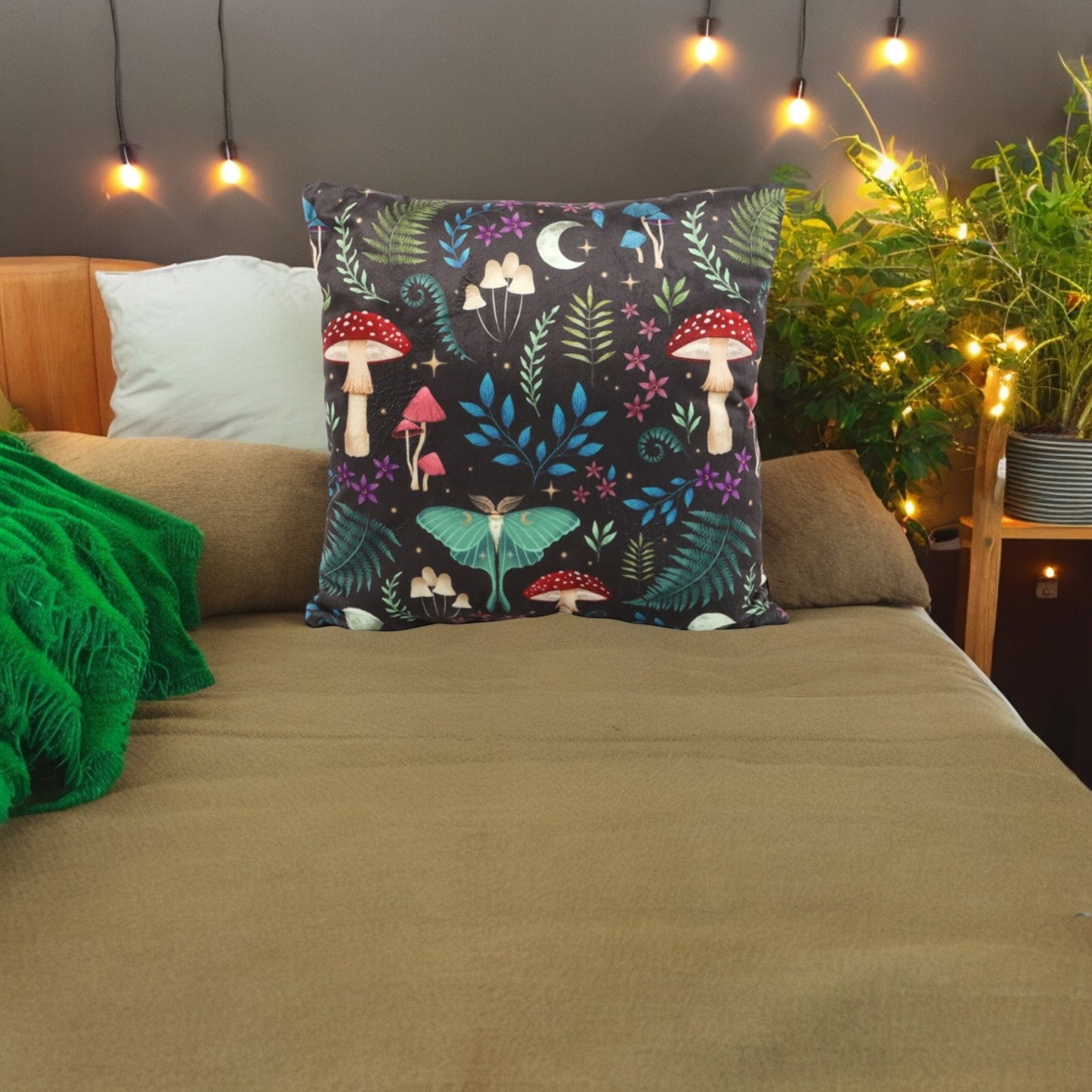 Dark Forest square cushion with mushrooms, wildflowers, moths and moons print.